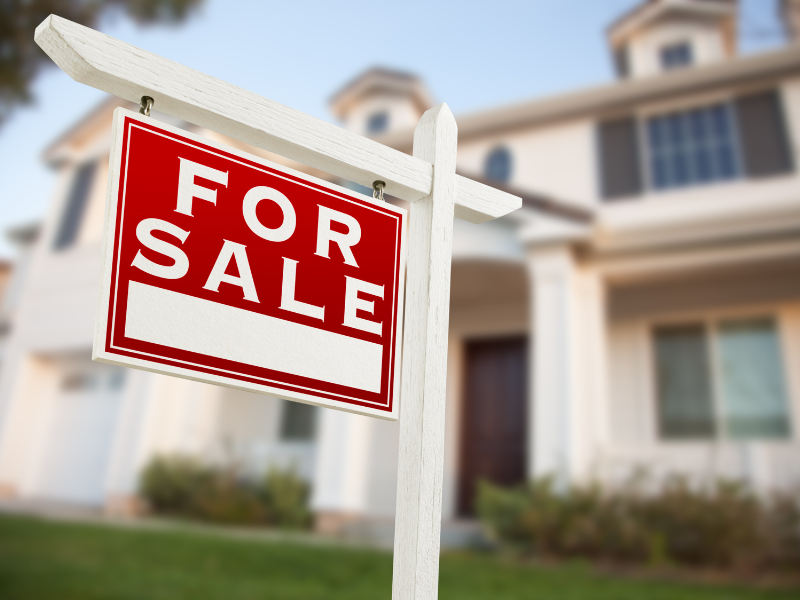 A ‘For Sale’ sign infront of an Edmonton home with high-efficiency heating. We discuss the benefits of upgrading to a high-efficiency furnace.