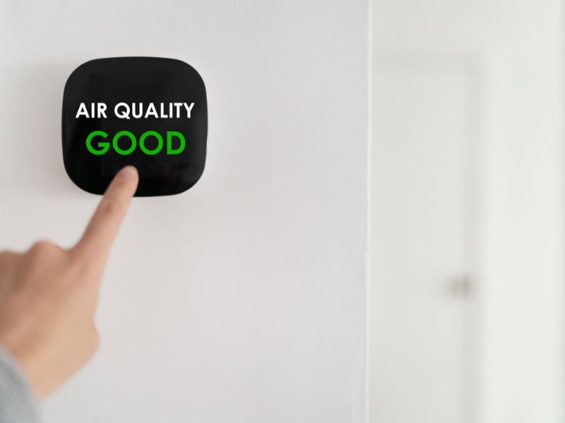 An Edmonton homeowner checks their home’s air quality. Showing you five simple ways to improve your home’s air quality.