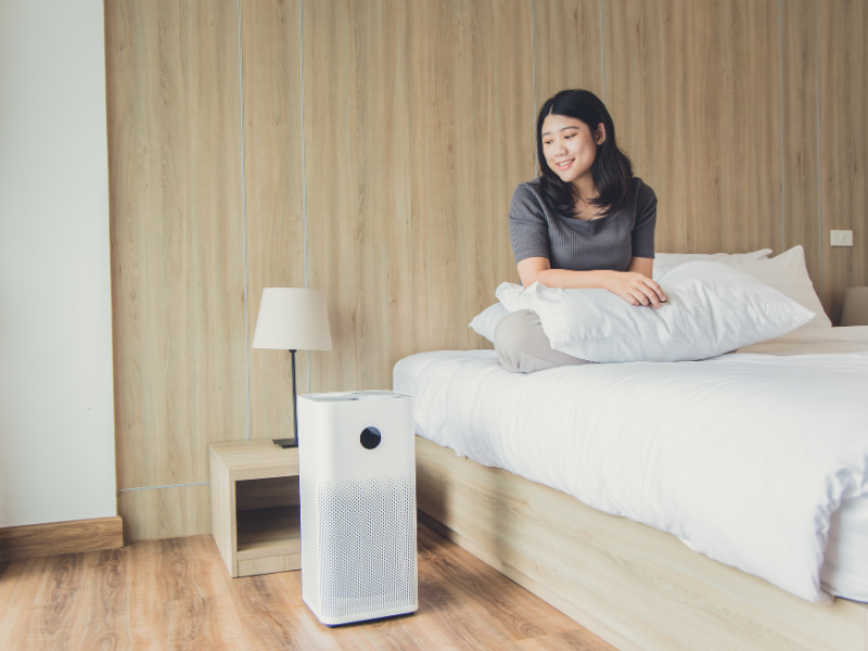 Air purifier improving air quality in an Edmonton bedroom. Showing you five simple ways to improve your home’s air quality. 