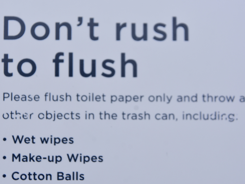 A sign in an Edmonton home's bathroom that says "Do Not Flush" non-flushable items. Preventing Clogged Drains and Leaks, expert tips from the plumbers at Habberjam At Home.