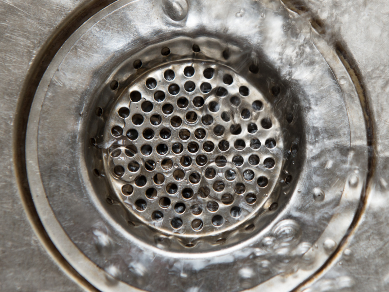 A drain strainer catching debris in a sink in an Edmonton home. Preventing Clogged Drains and Leaks, expert tips from the plumbers at Habberjam At Home.