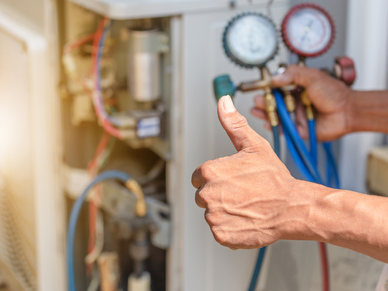 A Habberjam At Home HVAC technician inspecting an Edmonton homeowner's furnace. How to prepare your furnace for an Edmonton winter.