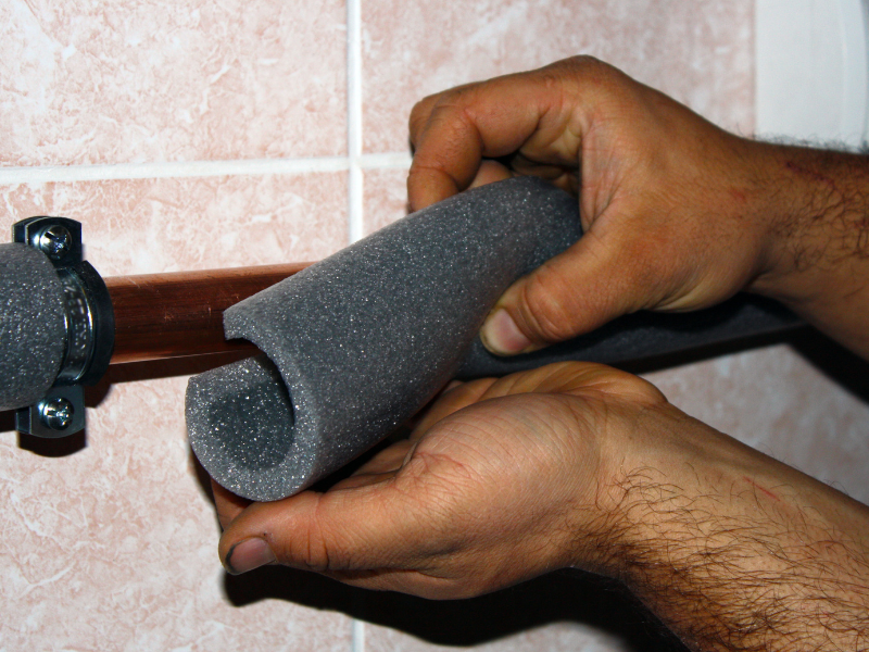 Insulated water pipes in an Edmonton homeowner's basement.