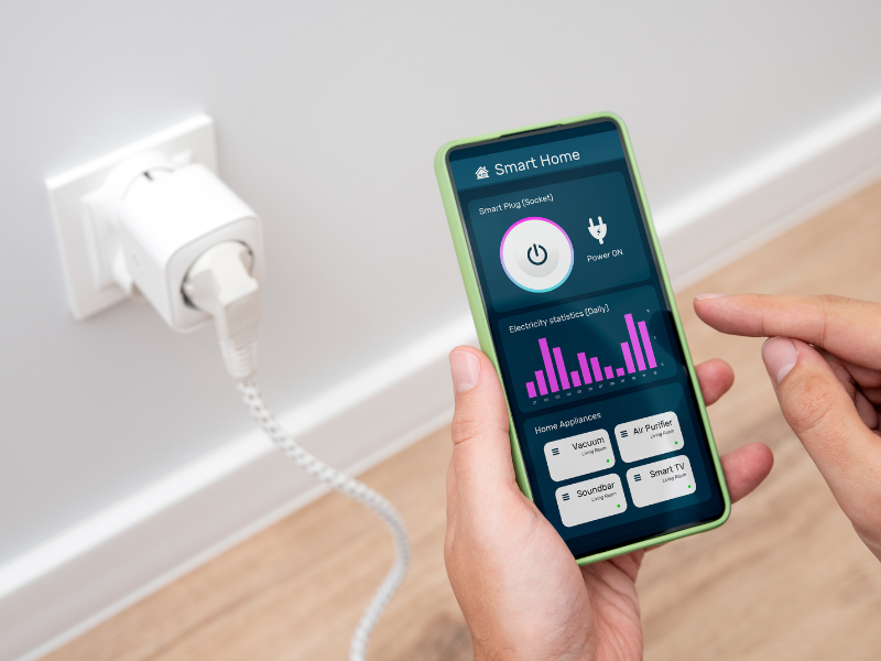 A close-up of a smart thermostat displaying temperature settings and energy-saving modes.