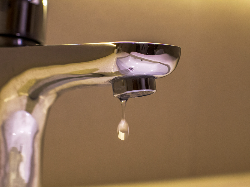 Dripping faucet wasting water in an Edmonton home. Busting Plumbing Myths For Edmonton Homeowners.