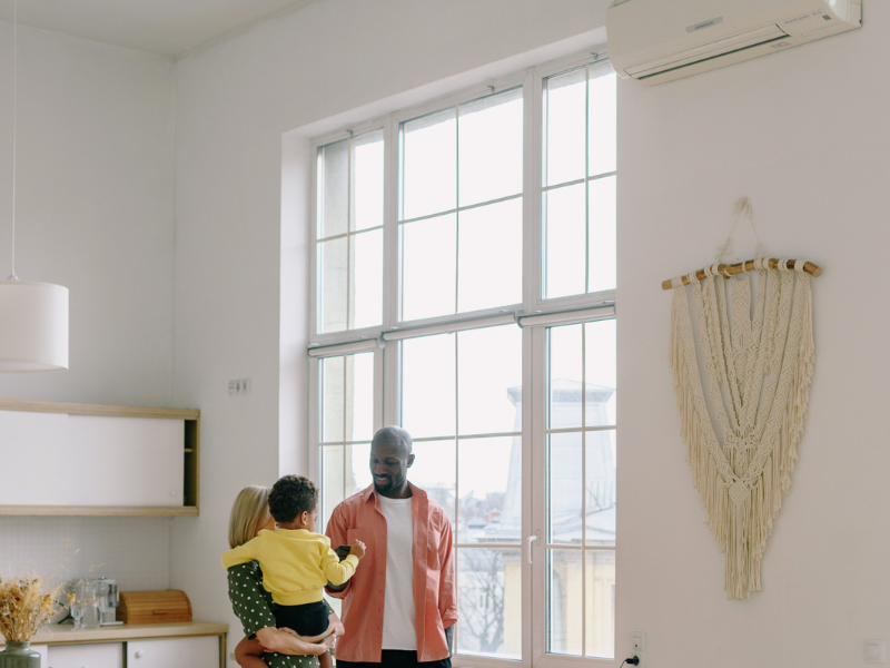 Happy family breathing clean air in a well-maintained Edmonton home.